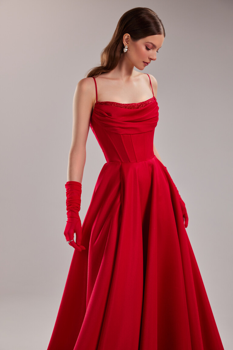 Close up of Rihanna red corset prom dress showing beaded neckline and boning