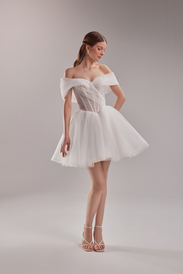 Full view of the Tutu mini ivory reception dress featuring a pleated tulle off-the-shoulder corset and A-line mini skirt.