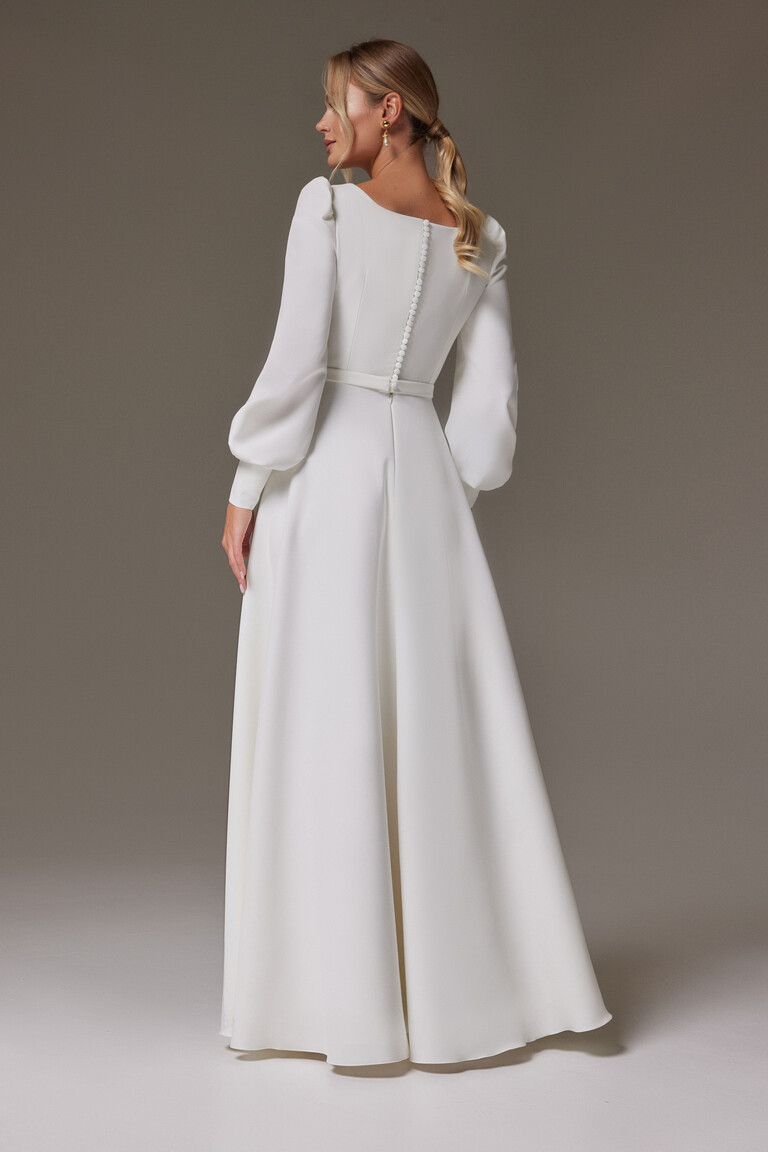 Back view of Camilla wedding dress showing row of buttons and long bishop sleeves in ivory crepe
