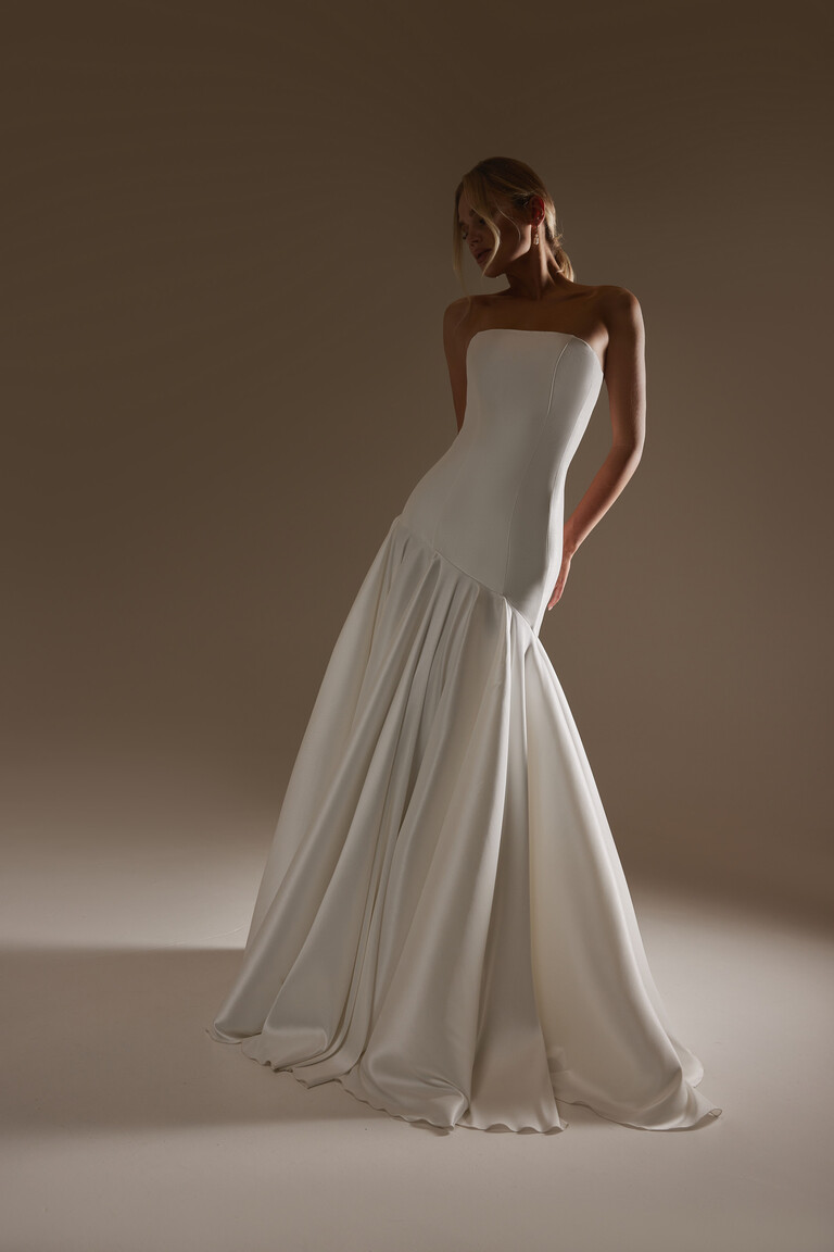 Holly minimalist wedding dress front view showing vertical seams and structured drop waist