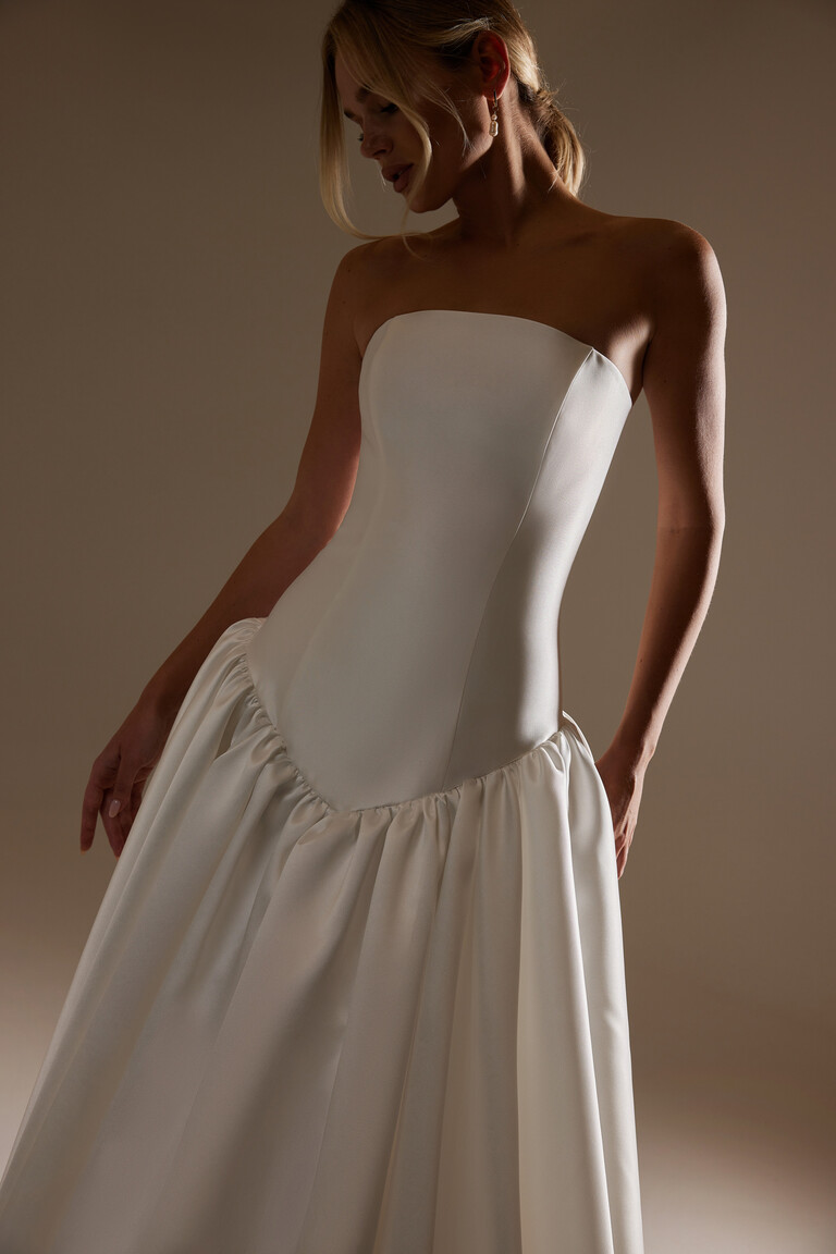 Front view of Francesca strapless bridal gown showing structural seams and sculpted basque waistline