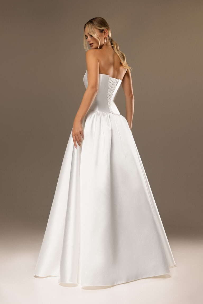Back view of Francesca A-line wedding dress with corset lace-up closure and voluminous Mikado skirt