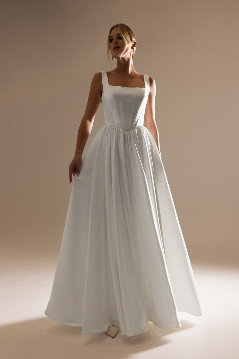 Unona Casia satin wedding dress front view featuring square neckline and basque waist
