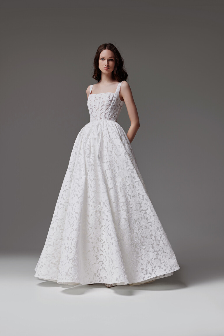 Unona Ruta sleeveless wedding dress with square neckline and floral lace