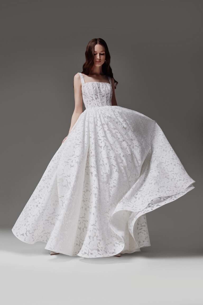 Ruta lace wedding dress in motion showing flowing A-line skirt movement