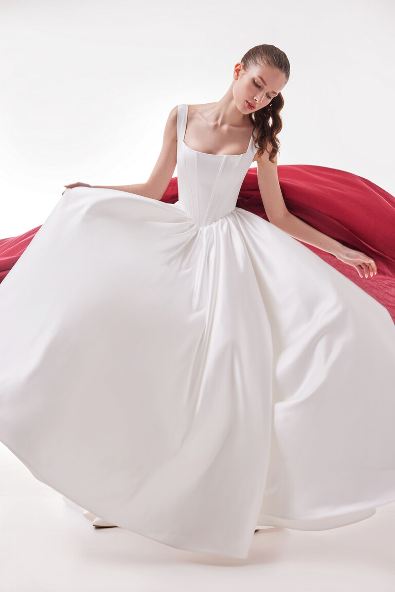Casia wedding dress with flared satin skirt and structured basque waist bodice