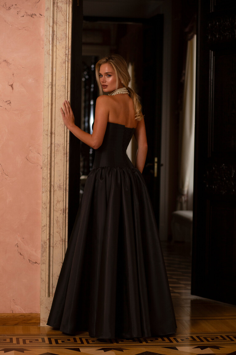 Back view of the Francesca black A-line ball gown showcasing the functional lace-up corset for a perfect, adjustable fit.
