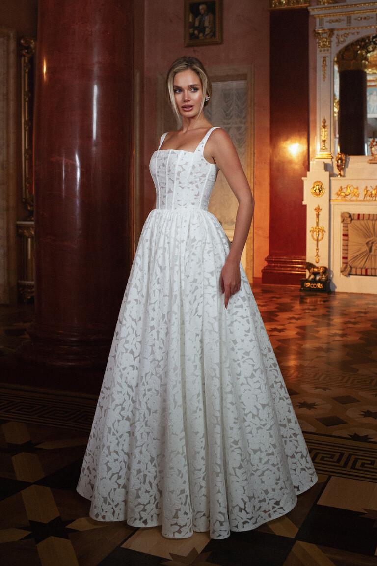 Front view of Ruta floral lace A-line wedding dress with wide straps in interior