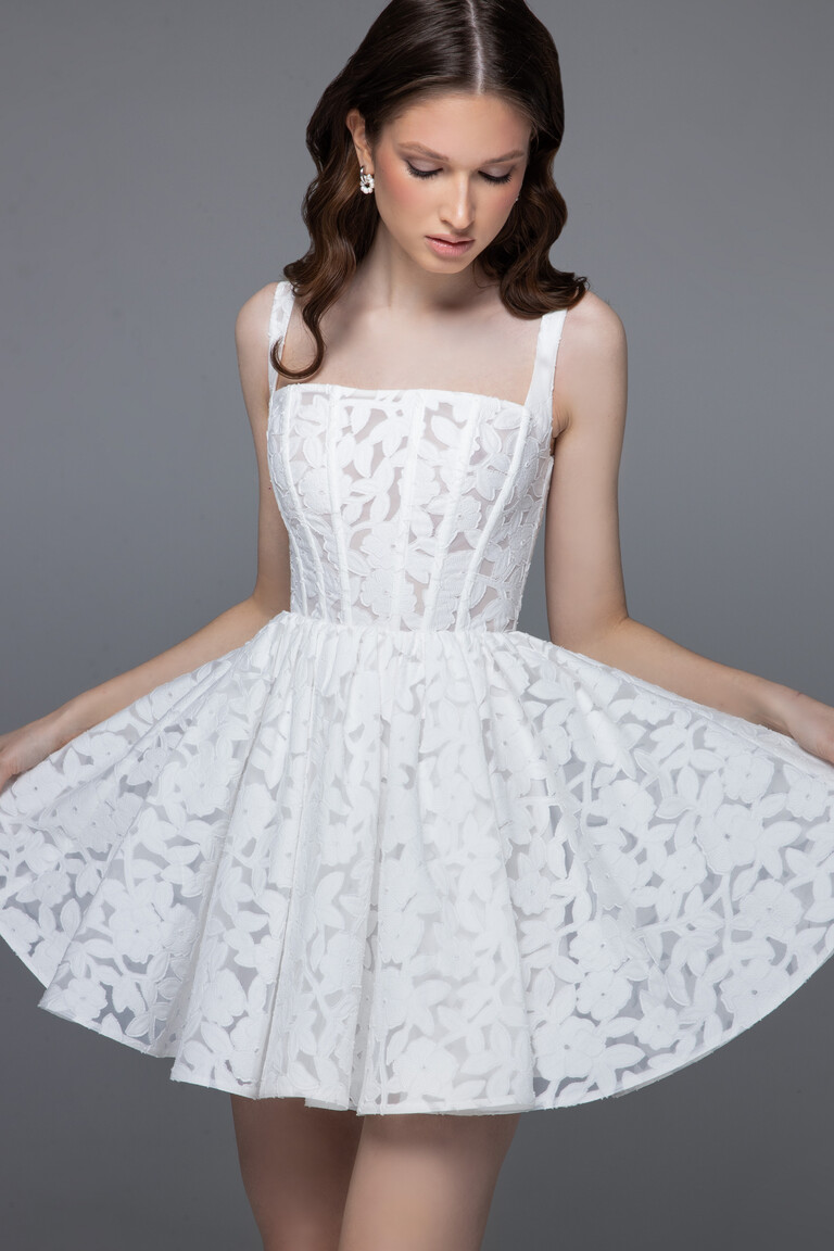 Ruta mini reception dress front view displaying floral lace fabric and playful A-line skirt