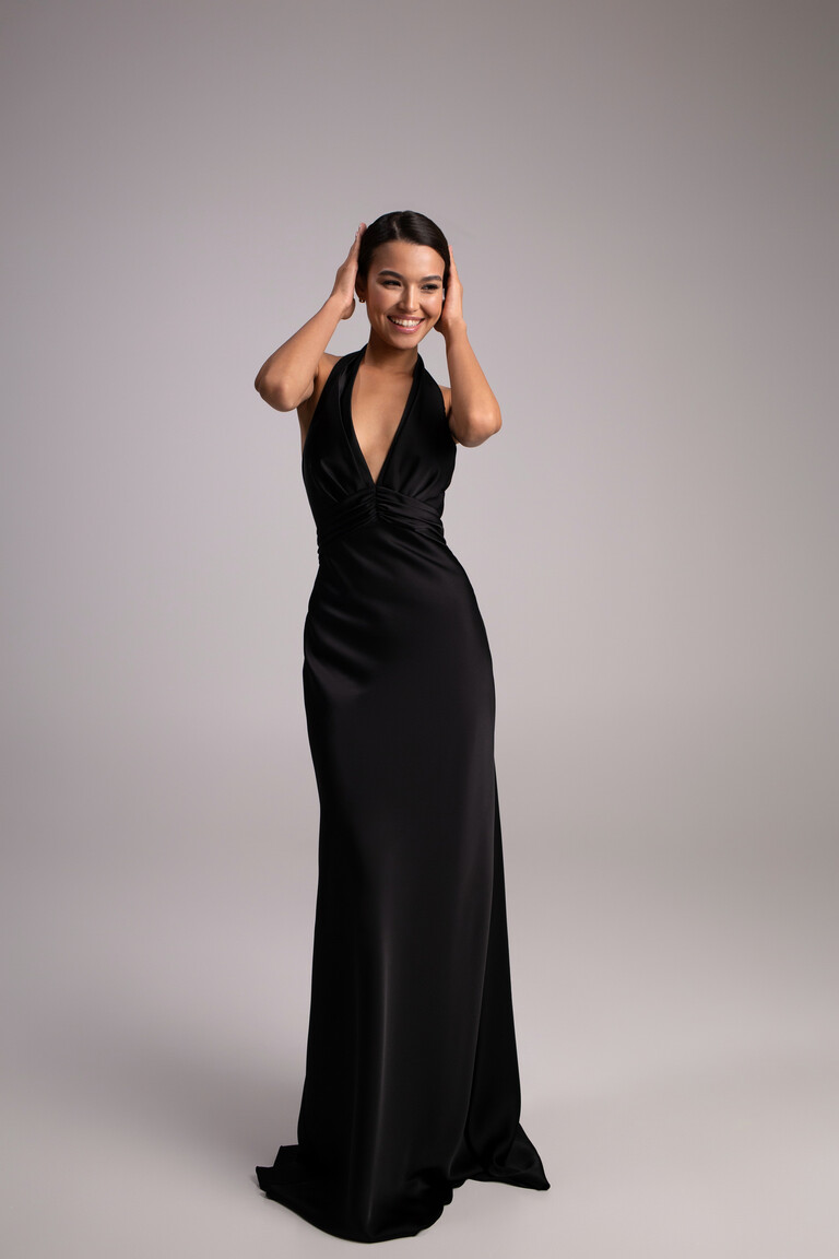 Front view of Athena black silk satin dress with gathered waist and deep V-neckline