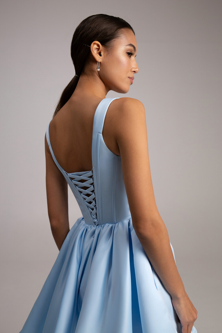 Rear closeup of Casia Mini blue satin dress featuring structured corset bodice vertical boning and lace-up back details