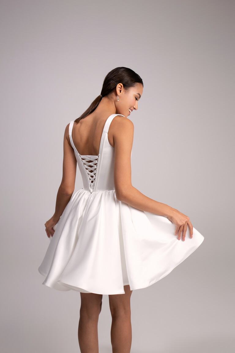 Rear view of Unona Casia Mini satin dress showing wide straps and voluminous short skirt