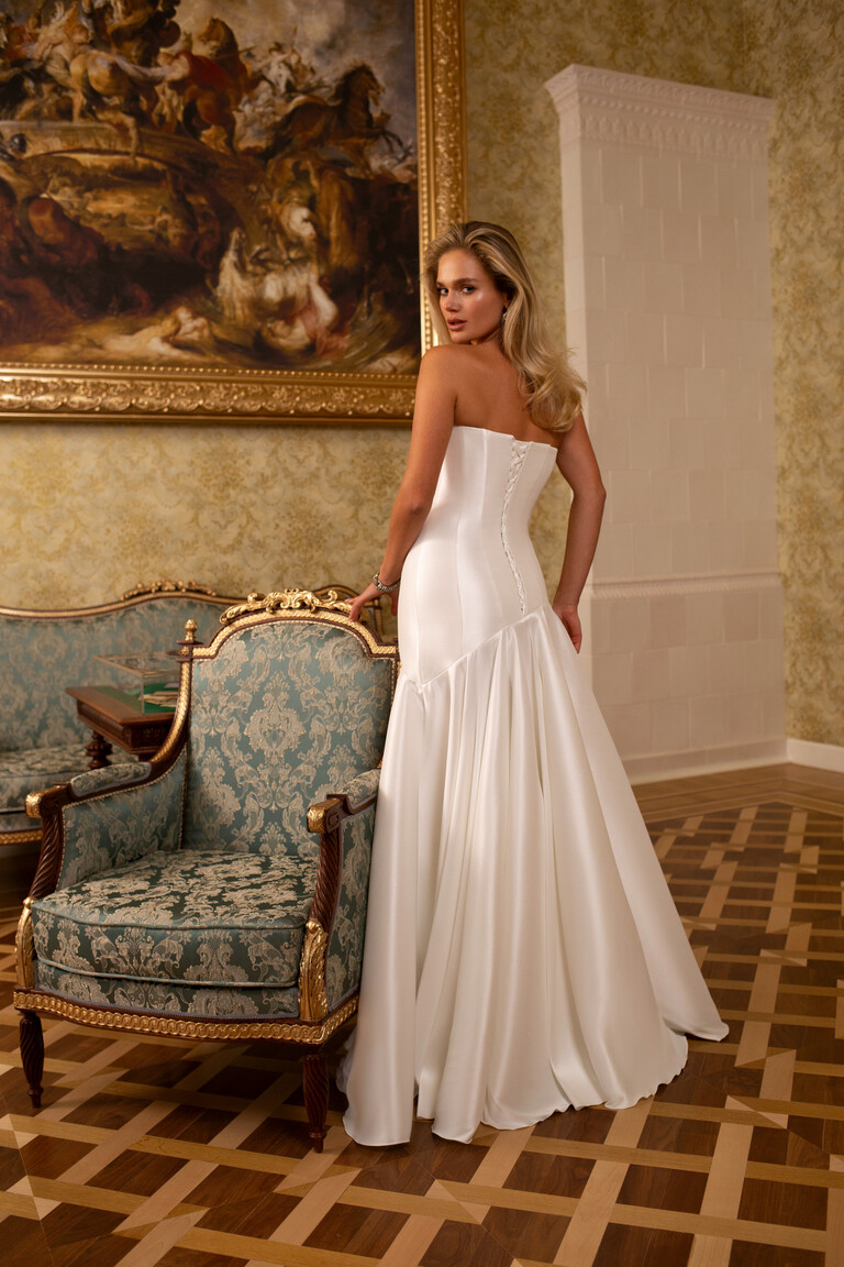 Full length back view of Holly mikado gown with corset lacing and voluminous gathered skirt