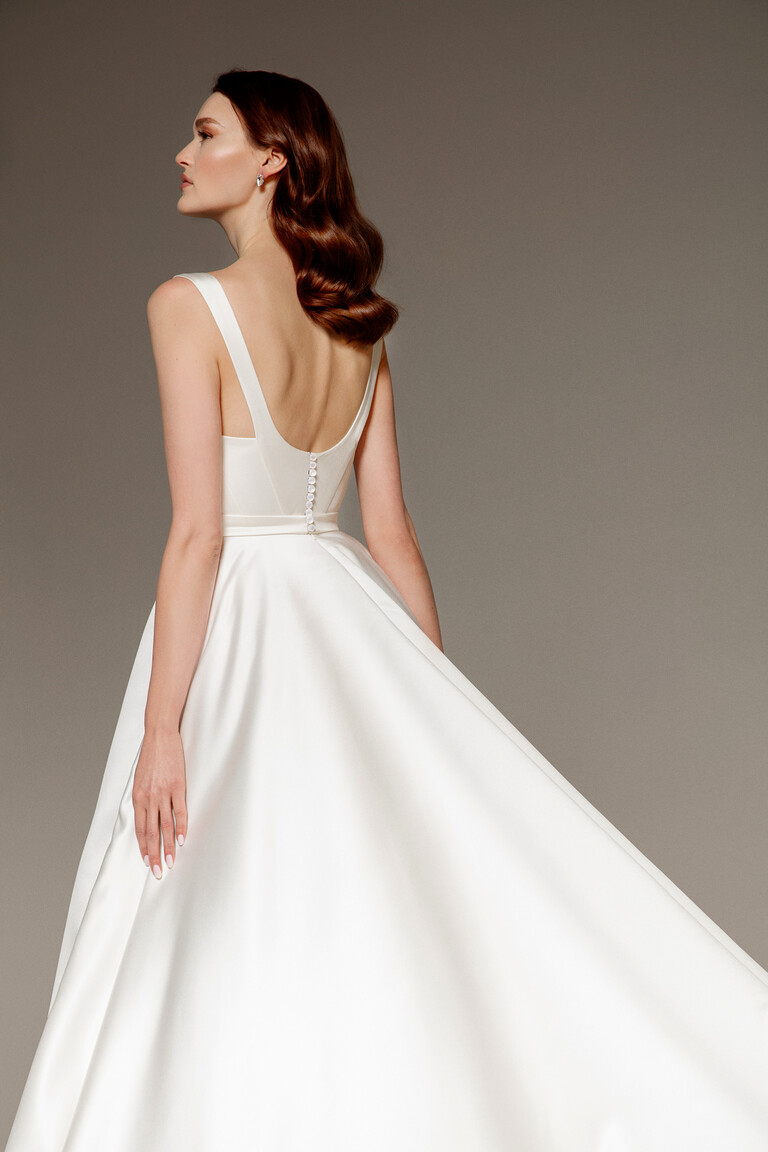 Elegant Buttoned Back Design on Satin Gown Mila-1 ivory satin wedding dress back detail with deep U-shape and row of covered buttons