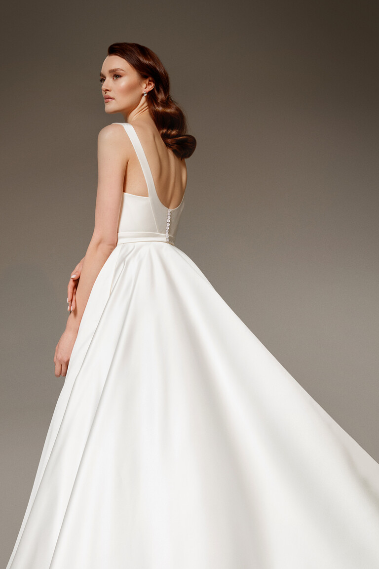 Profile View of Mila-1 Satin Ball Gown Side back view of Mila-1 satin princess wedding dress showing silhouette and waistband