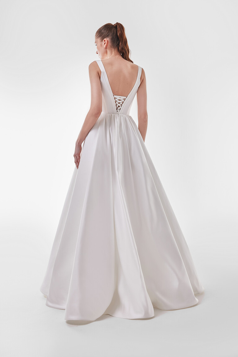 Full length back view of Casia dress showing smooth satin fabric flow and V-back