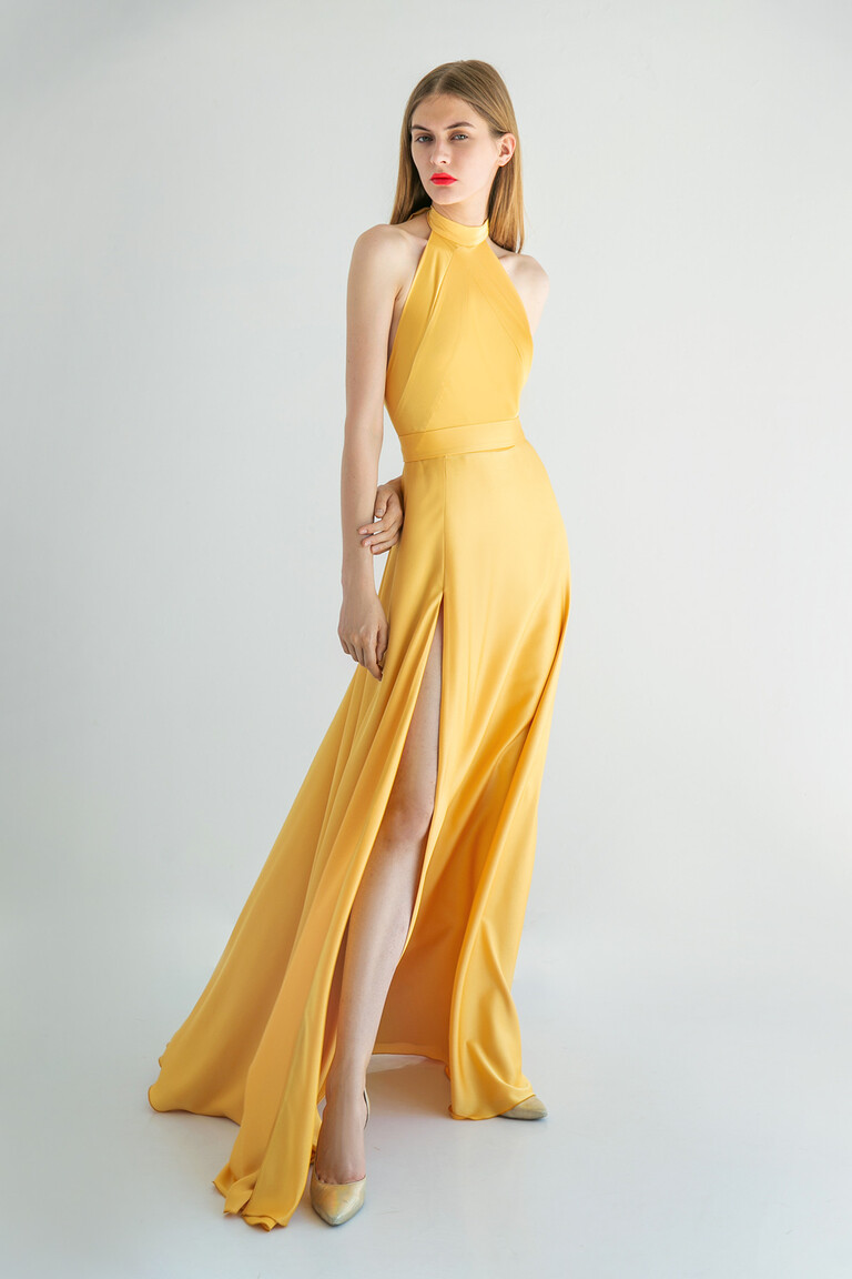 Full front view of the Unona Mary floor-length yellow halter dress, a sleeveless silk gown for evening and special occasions.