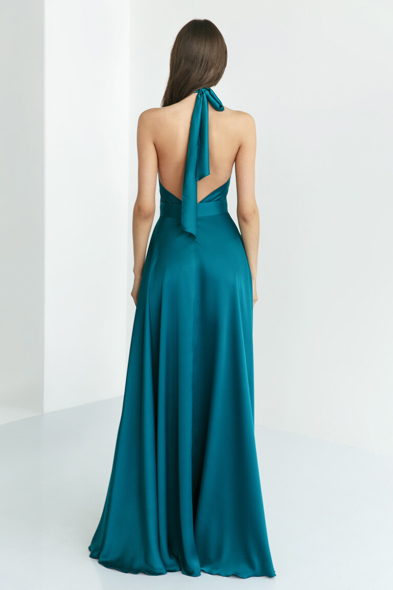 Unona Mary emerald silk dress from the back showing the full floor-length A-line skirt and halter tie.