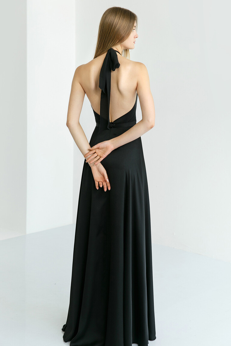Back view of the Unona Mary black silk dress highlighting the dramatic low open back and long halter neck ties.