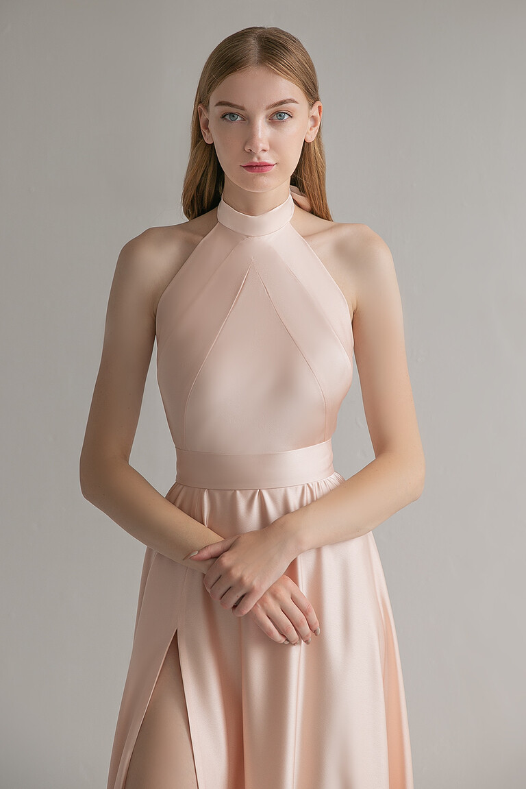Unona Mary sleeveless peach silk dress front view with geometric bodice seams and a wide defined waistband.