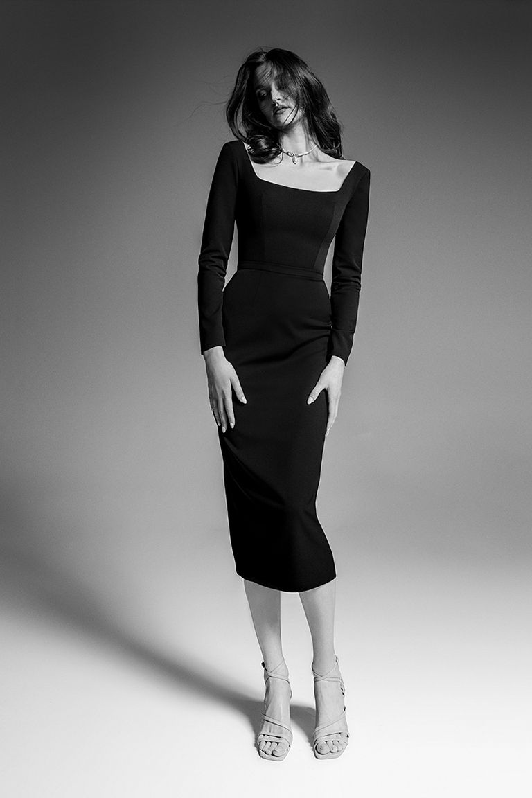 Front view of the Unona Viola black long sleeve midi dress featuring a sleek sheath silhouette and square neckline