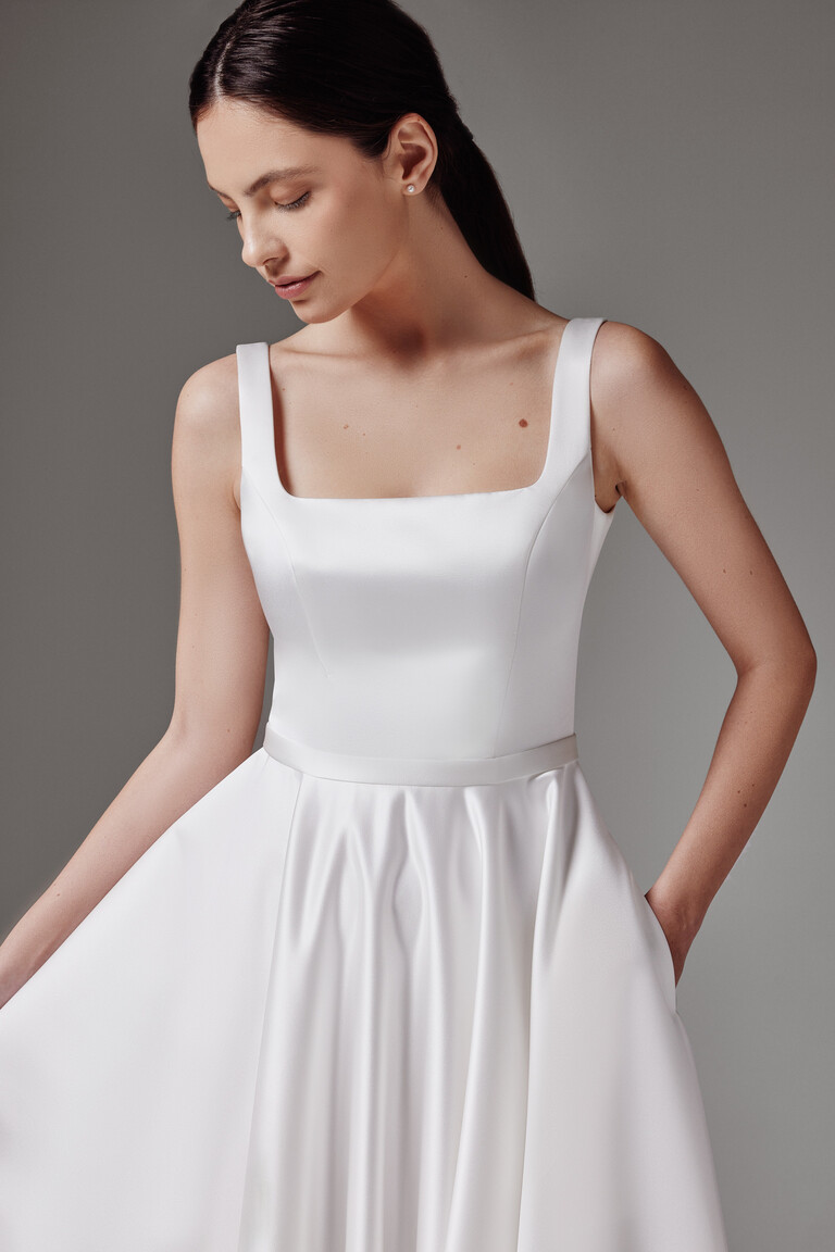 Front view of the Vlada off-white modern wedding dress bodice showcasing precise darts and a clean square neckline