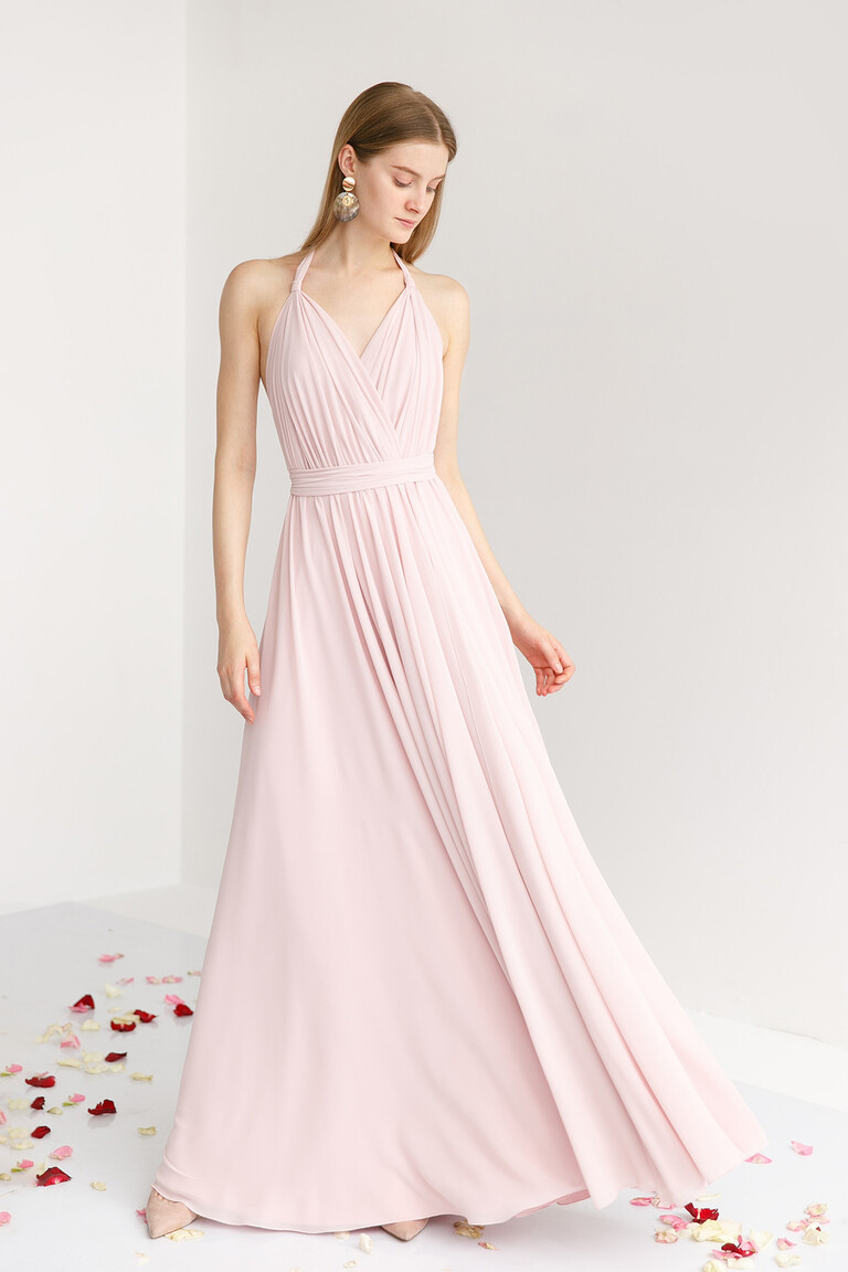 Front view of the Unona Calypso powder pink floor-length gown with a flowing A-line skirt and halter neckline