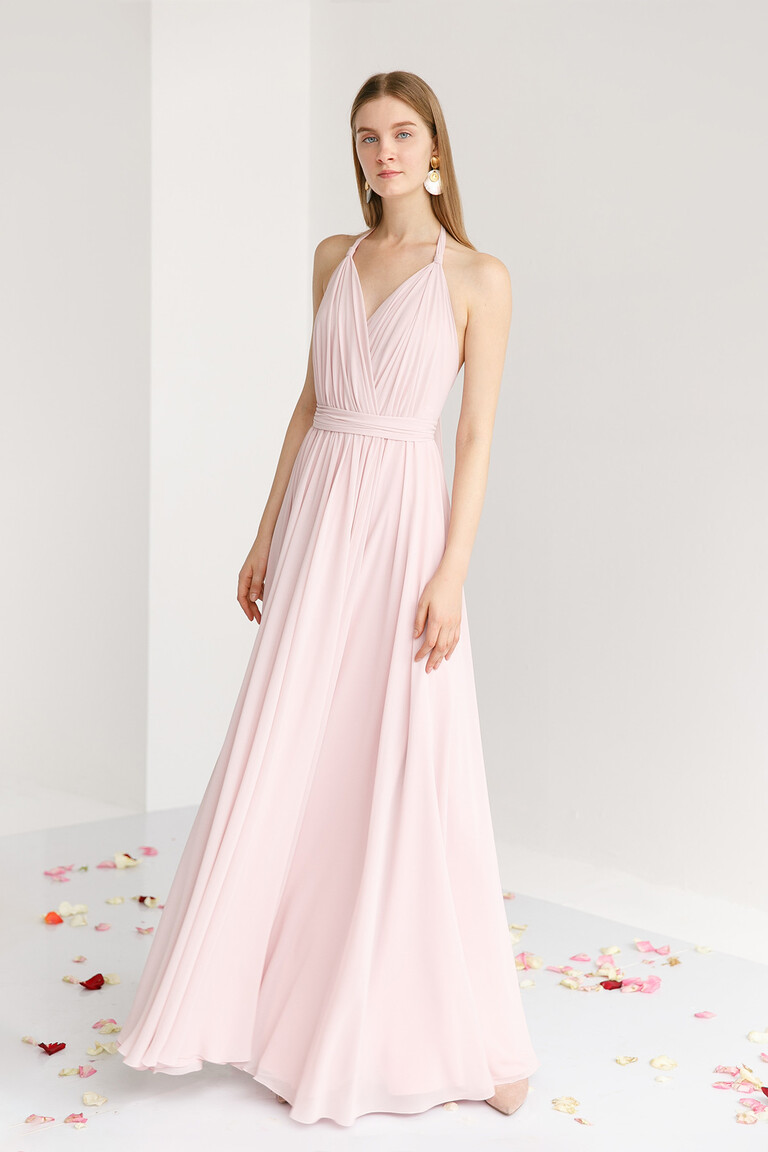 Unona Calypso sleeveless evening gown in powder with a pleated and draped bodice and a wide waistband