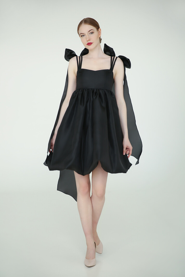 Leoni black organza cocktail dress featuring a square neckline, balloon skirt, and dramatic removable shoulder bows.