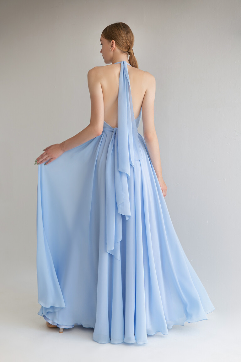 Back view of the Unona Calypso blue Greek-style dress highlighting the dramatic open back and halter neck tie.