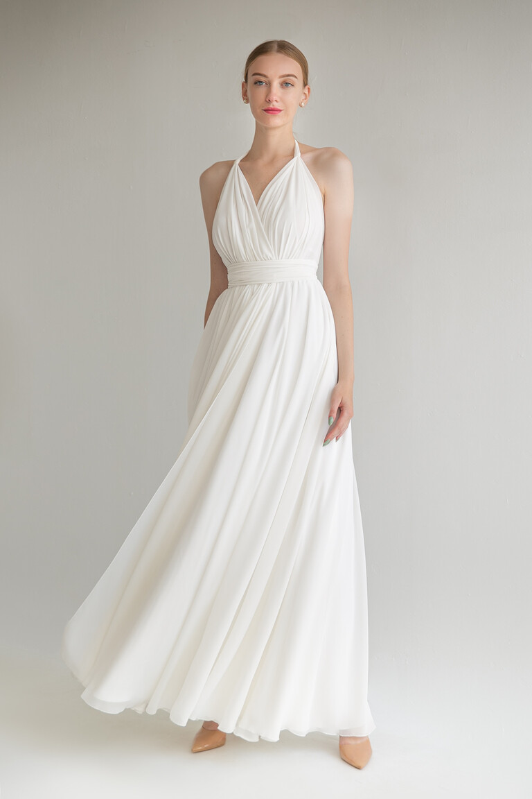 Front view of the Unona Calypso ivory bridal gown featuring a Greek-style draped bodice and a floor-length chiffon skirt.