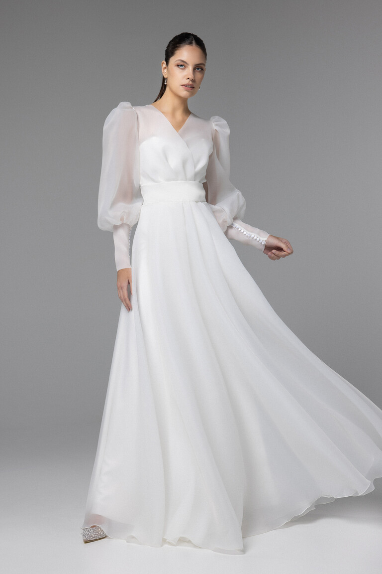 Unona Cape Sonia Ivory Organza Bridal Wrap with Long Sleeves Front view of Unona Cape Sonia ivory organza bridal wrap with long sheer puff sleeves and V-neck.