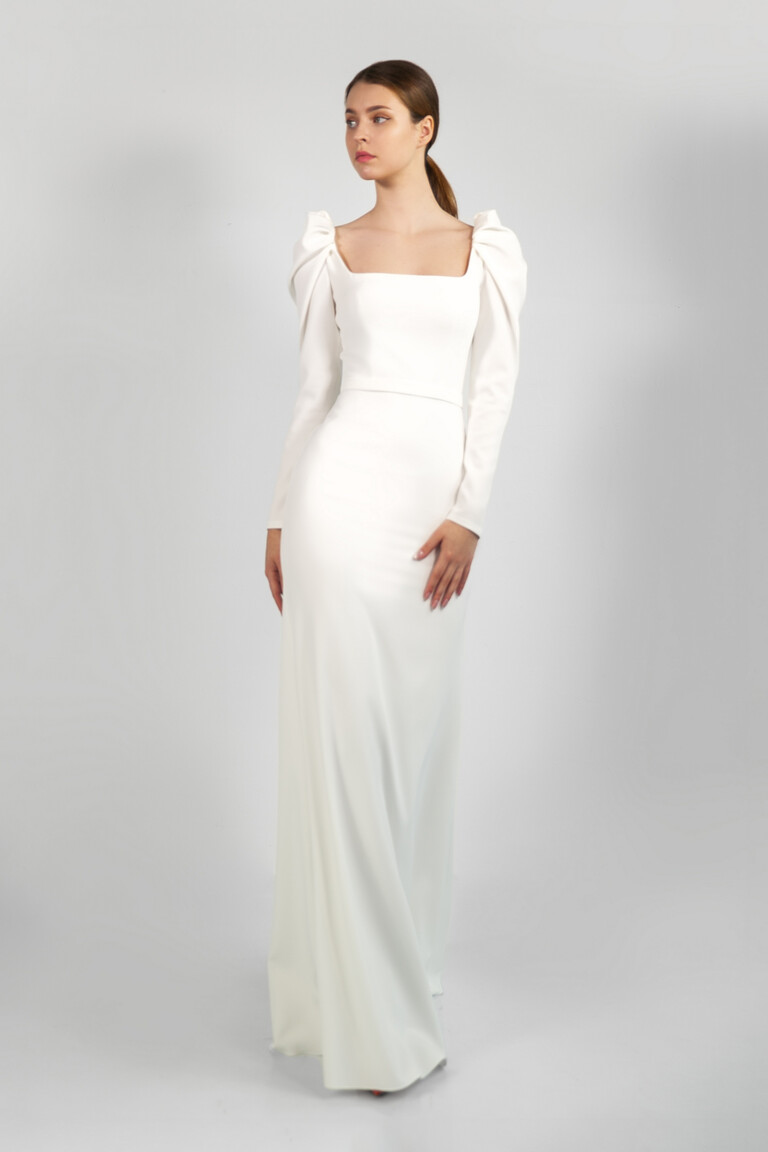 Bianca Modest Crepe Wedding Dress Front View Front view of Unona Bianca ivory stretch crepe wedding dress with square neckline and long sleeves.