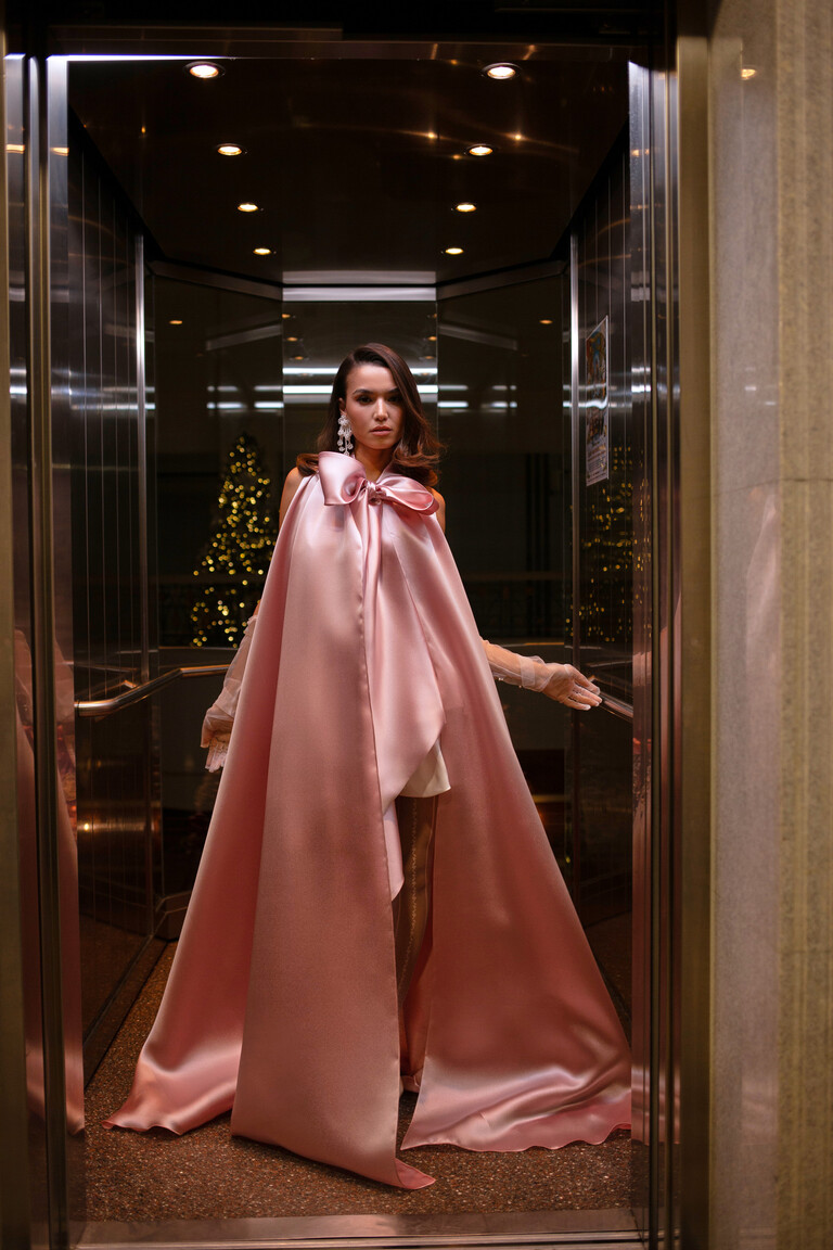 Floor Length Powder Organza Cape for Gala Events Full body look of the powder organza Cape Casey by Unona. Glamorous A-line formal cape with open front and high neck bow.