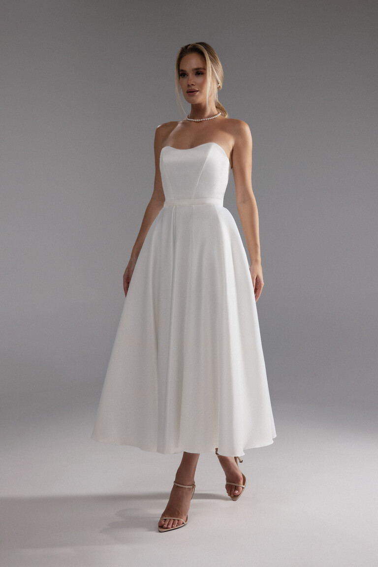 Front view of the Lizzie ivory strapless midi dress for modern minimalist reception or party.