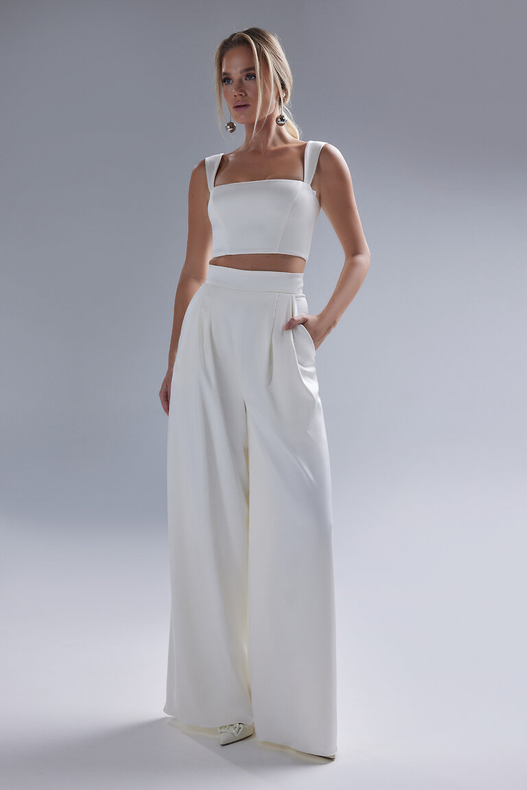Andrea Minimalist Bridal Top with Trousers Full body front view of Andrea ivory stretch satin crop top with square neckline paired with high waisted bridal trousers.