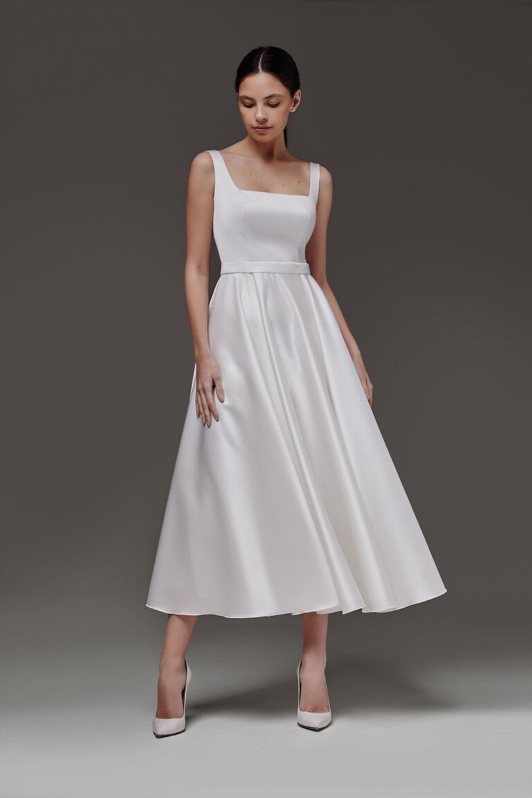 Elegant Sleeveless Vlada Midi Bridal Gown Elegant Vlada midi A-line wedding dress in off-white satin featuring a modern sleeveless square neckline