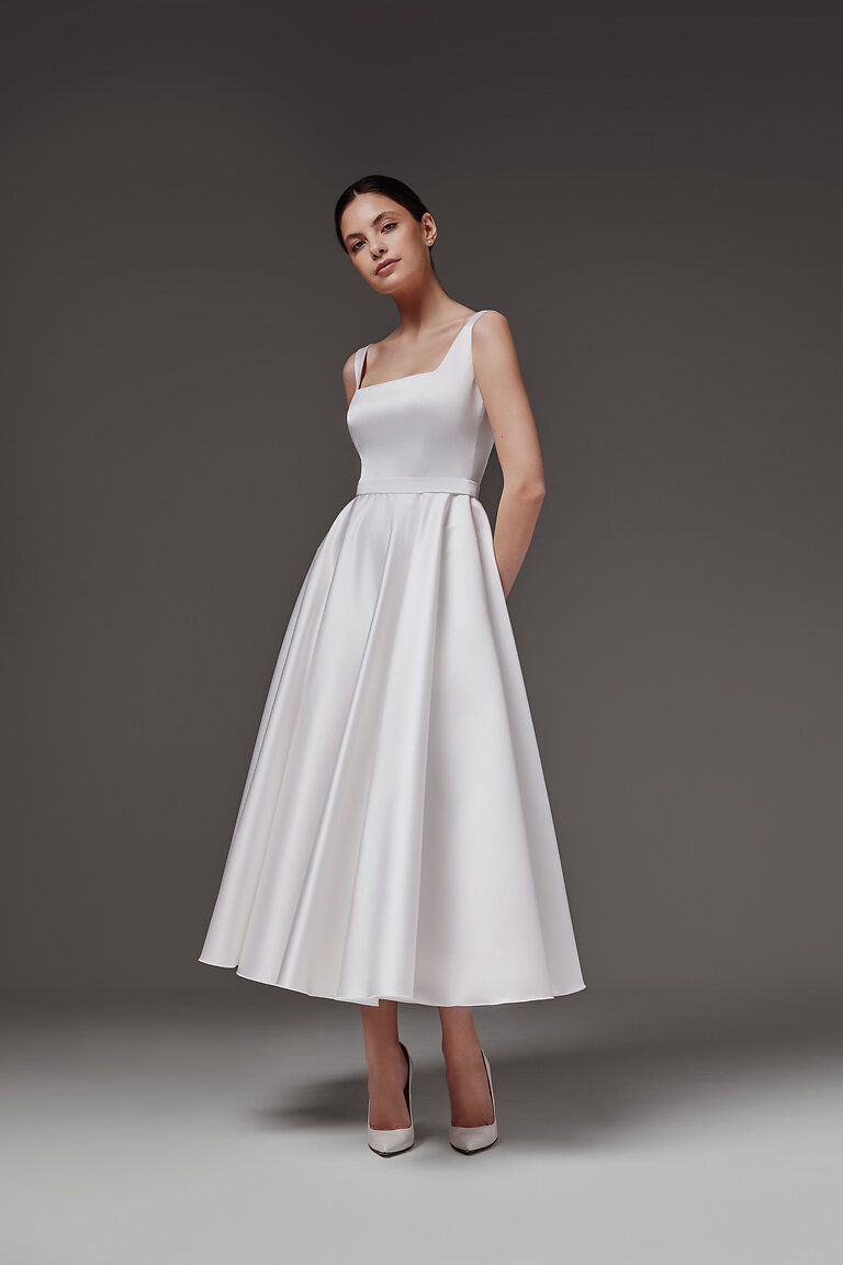Modern Vlada Midi Dress for City Weddings Front full-length view of the modern Vlada midi off-white bridal dress perfect for engagement parties by Unona
