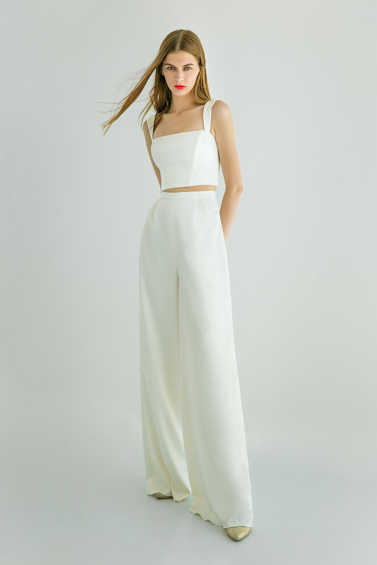 Modern Minimalist Bridal Separates Andrea Full length view of Andrea ivory satin crop top with square neckline worn as a modern minimalist bridal separate outfit.