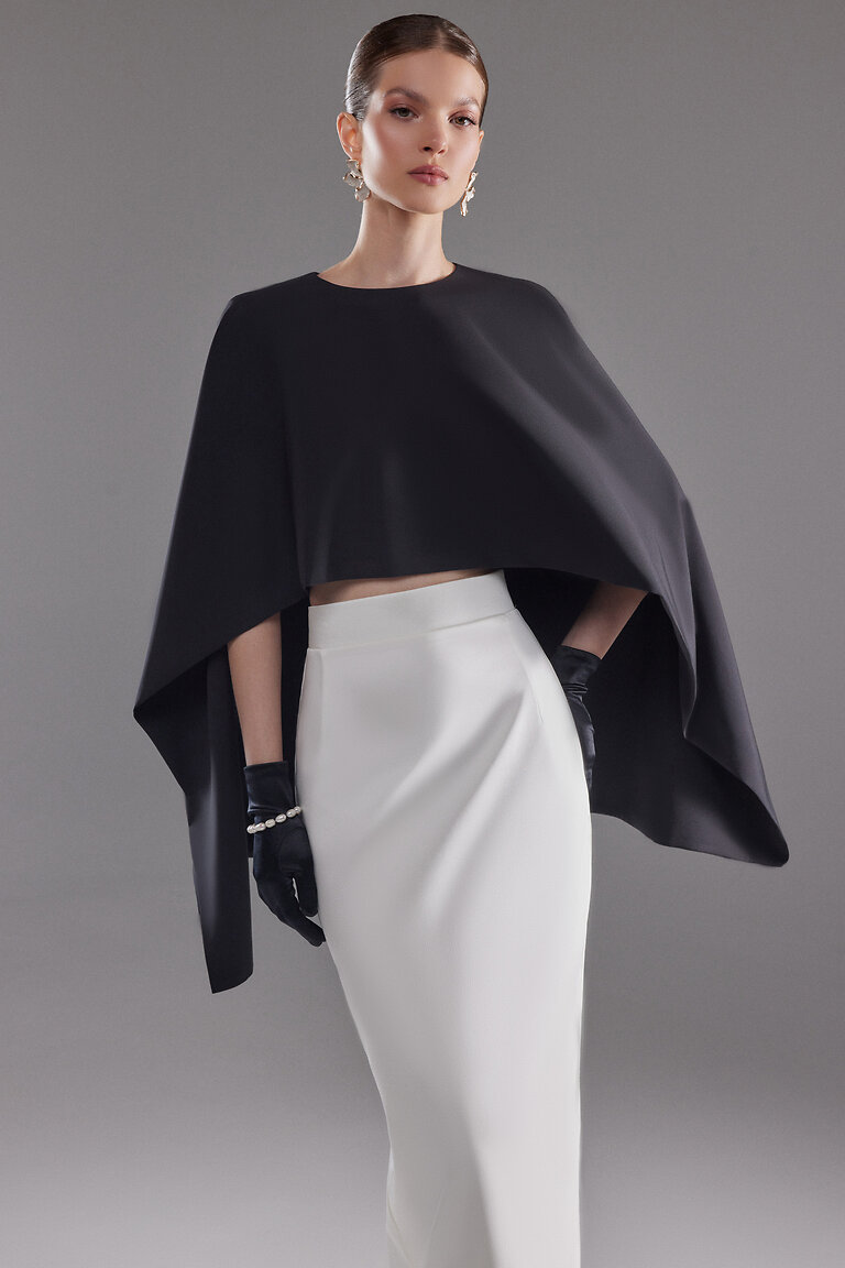 Modern Black Cape Ell Styled for a Black Tie Event Black minimalist Cape Ell by Unona. High neck sleeveless formal cover up showing chic stretch crepe drape and styling.