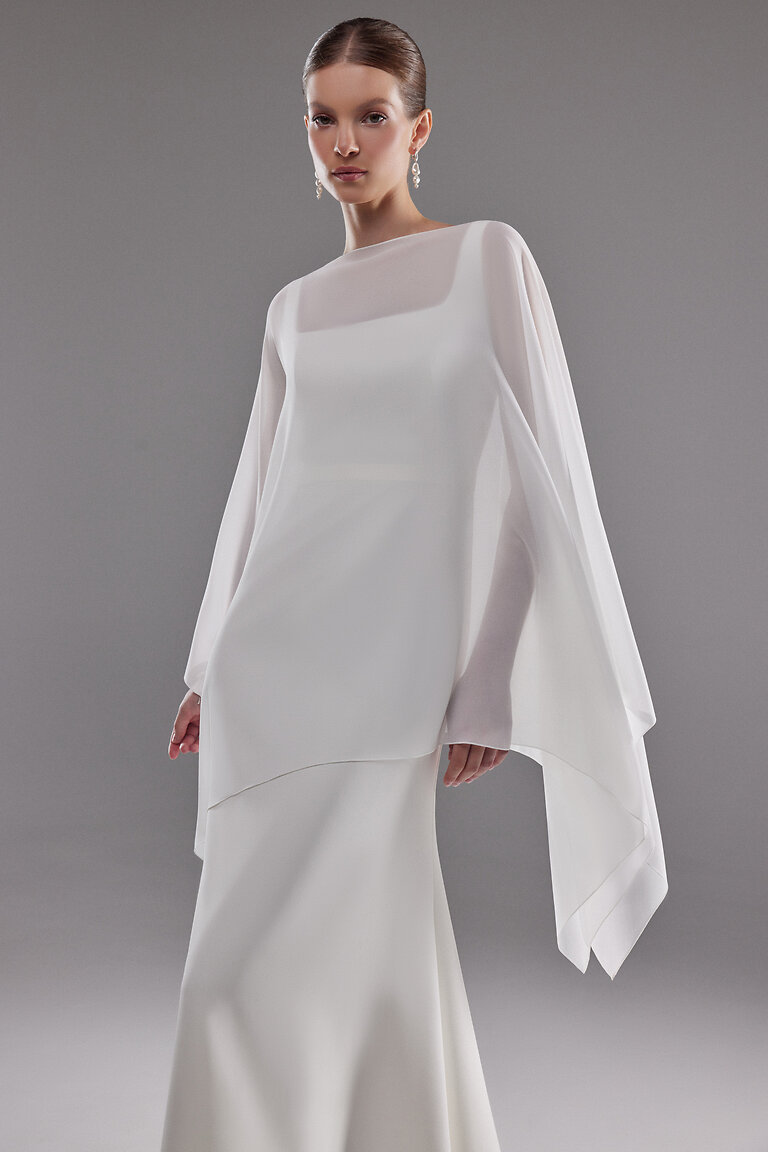 Elegant High Neck Bridal Cape by Unona Close front view of the Iman white chiffon wedding topper showing the high neckline and airy drape by Unona.