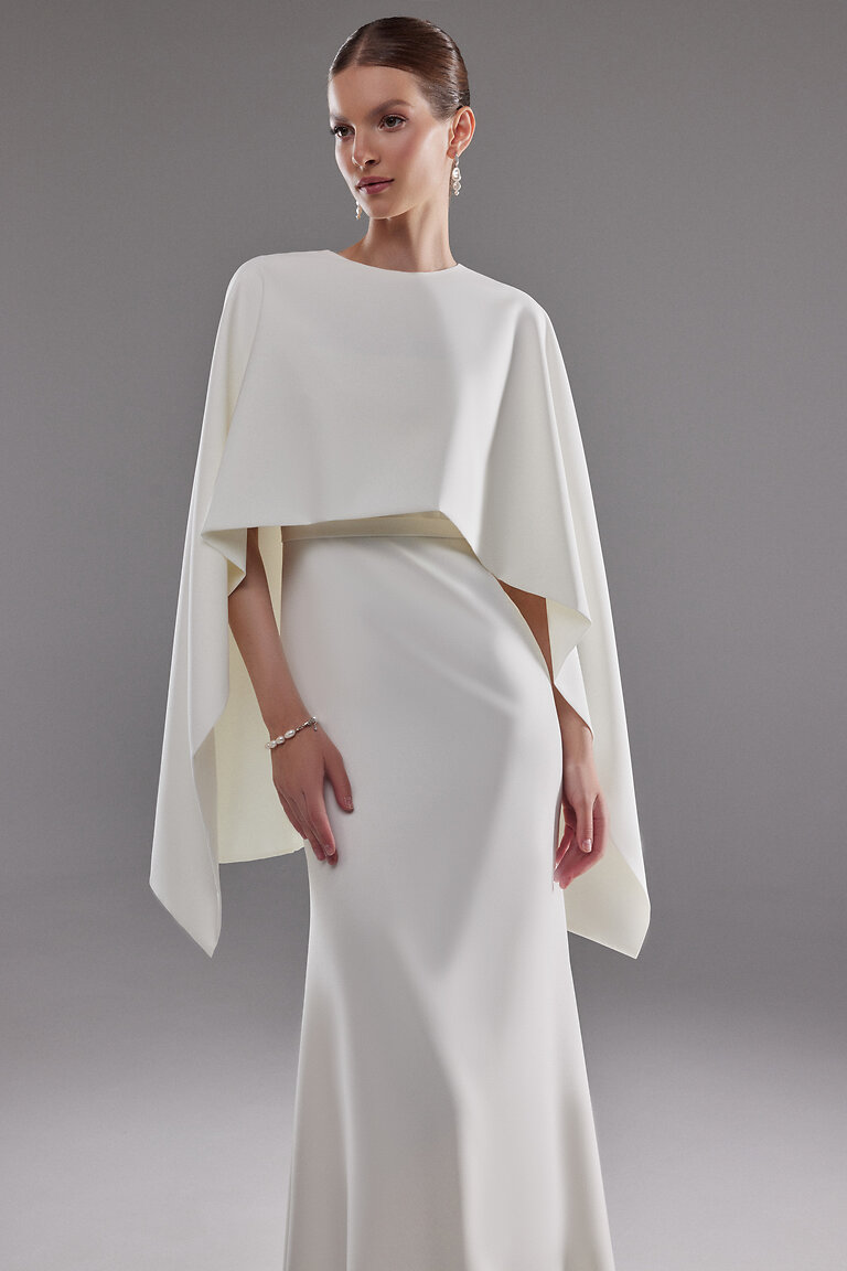 Modern Minimalist Ivory Wedding Cover Up Close front view of minimalist ivory bridal Cape Ell by Unona featuring a chic high neckline and modern drape.