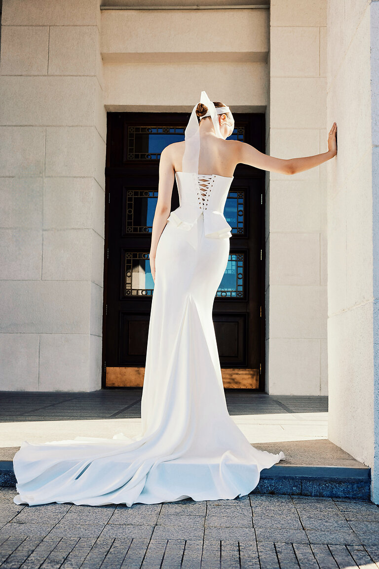 Modern Mermaid Bridal Skirt with Train Full length back view of the ivory Gina Skirt by Unona. Modern fit and flare bridal skirt with a sweeping train.