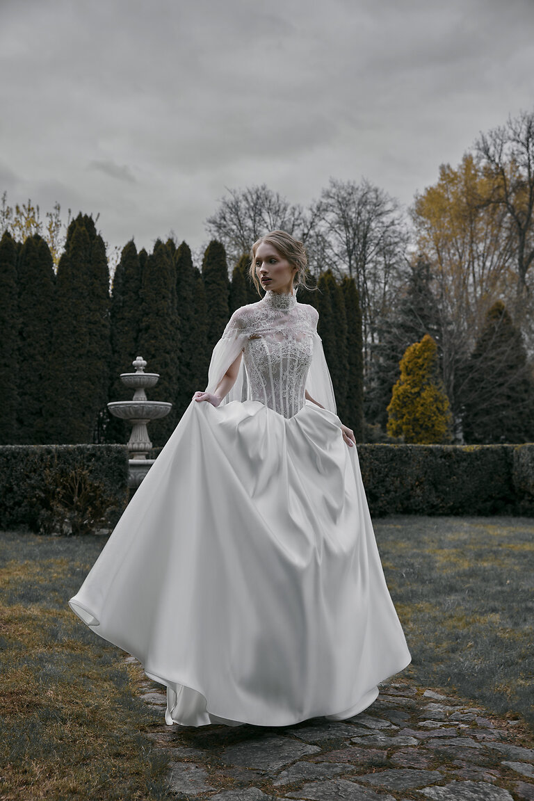 Full Length Off-White Tulle Bridal Cape Full body front view of Evelyn romantic wedding cape in off-white tulle and lace worn over a classic bridal gown.