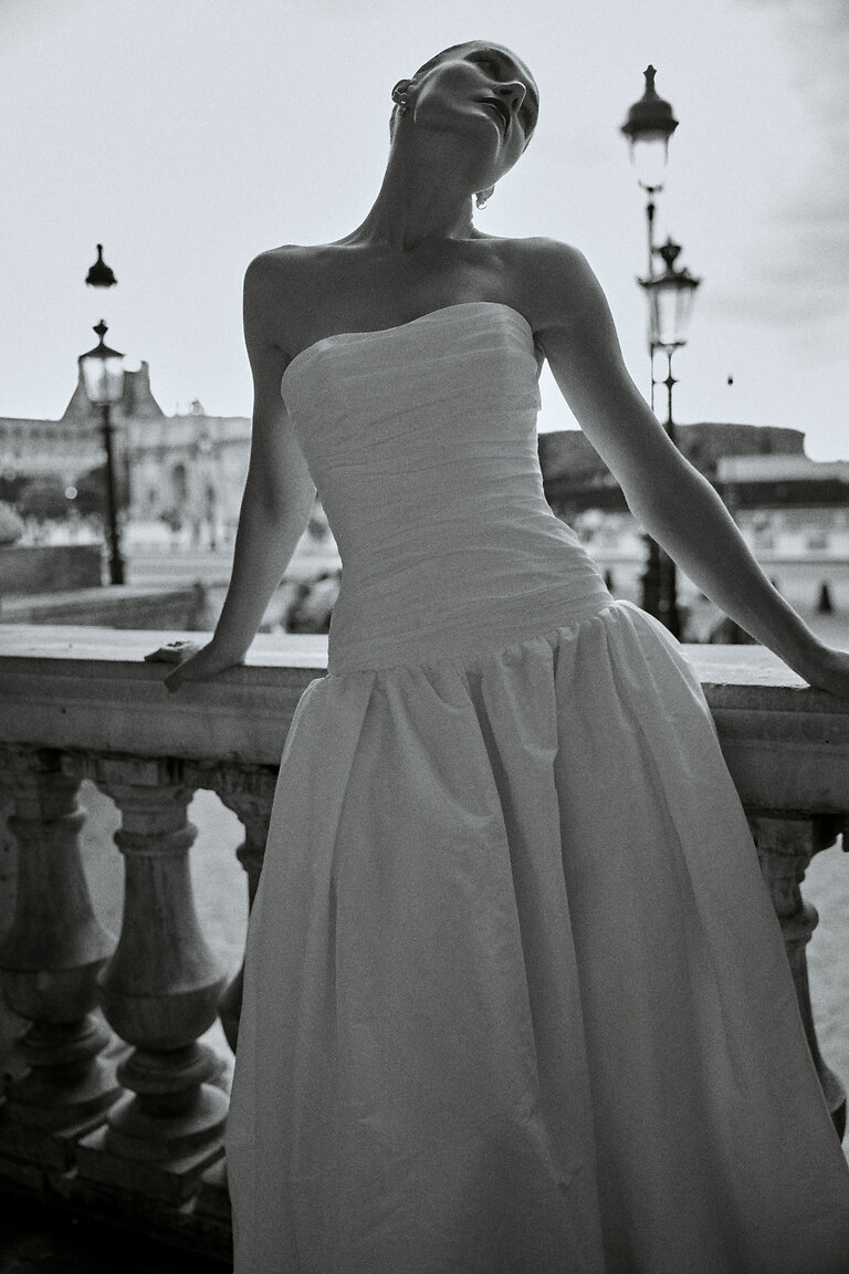 Elegant Strapless Straight Neckline Details Off-white Louise strapless wedding dress featuring a textured ruched bodice and elegant straight neckline.
