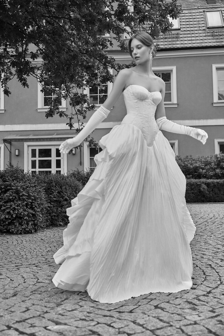 Editorial Style Nerina Basque Waist Bridal Gown Black and white photo of Unona Nerina off-white strapless wedding dress highlighting the basque waist and A-line skirt.